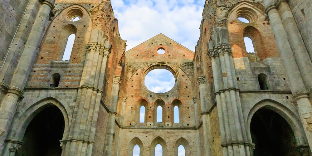 Saint or San Galgano medieval uncovered Abbey Church ruins. Tuscany, Italy