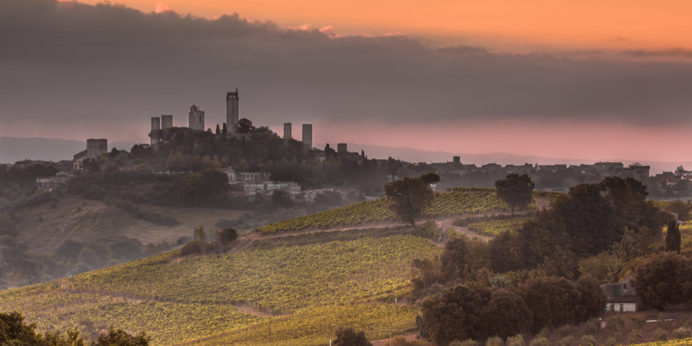 Towers of World Heritage Site Village San Gimignano on the top of a Hill during Sunrise, Italy